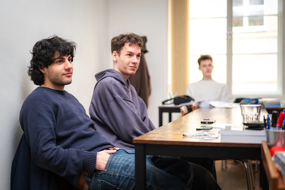 Students seated around a study table