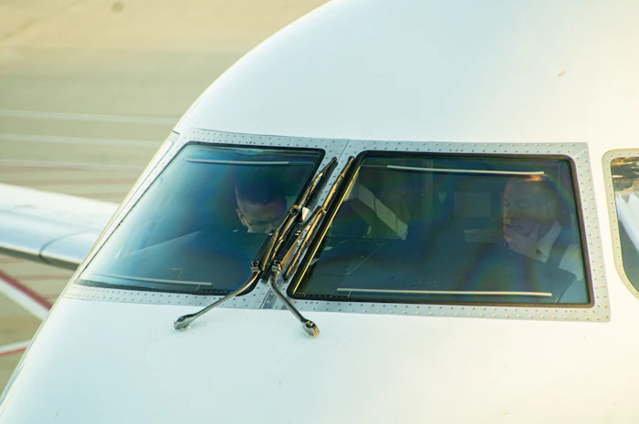 Two pilots in an airliner cockpit